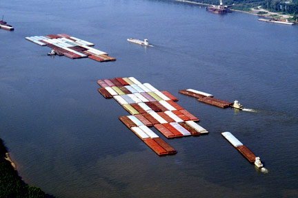 This is a fleet of barges like those that float up and down the Mississippi River. If you were injured on a barge near Kenner or in Southeastern Louisiana, call a Kenner Maritime Attorney today.
